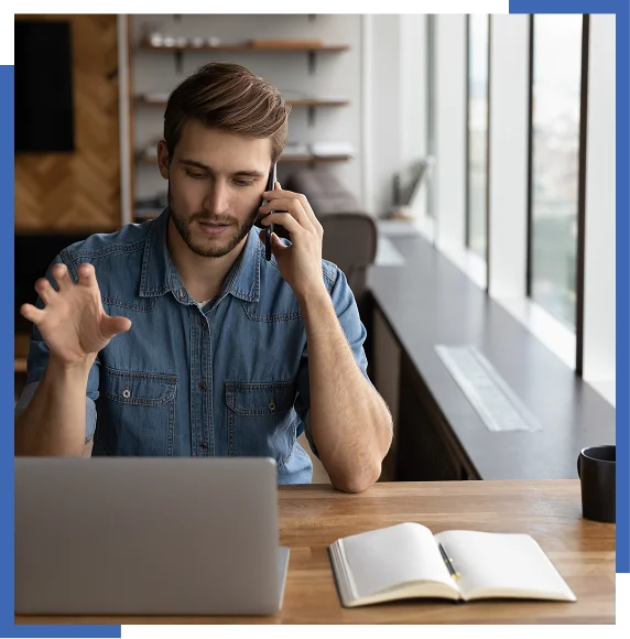 Person talking on phone in office