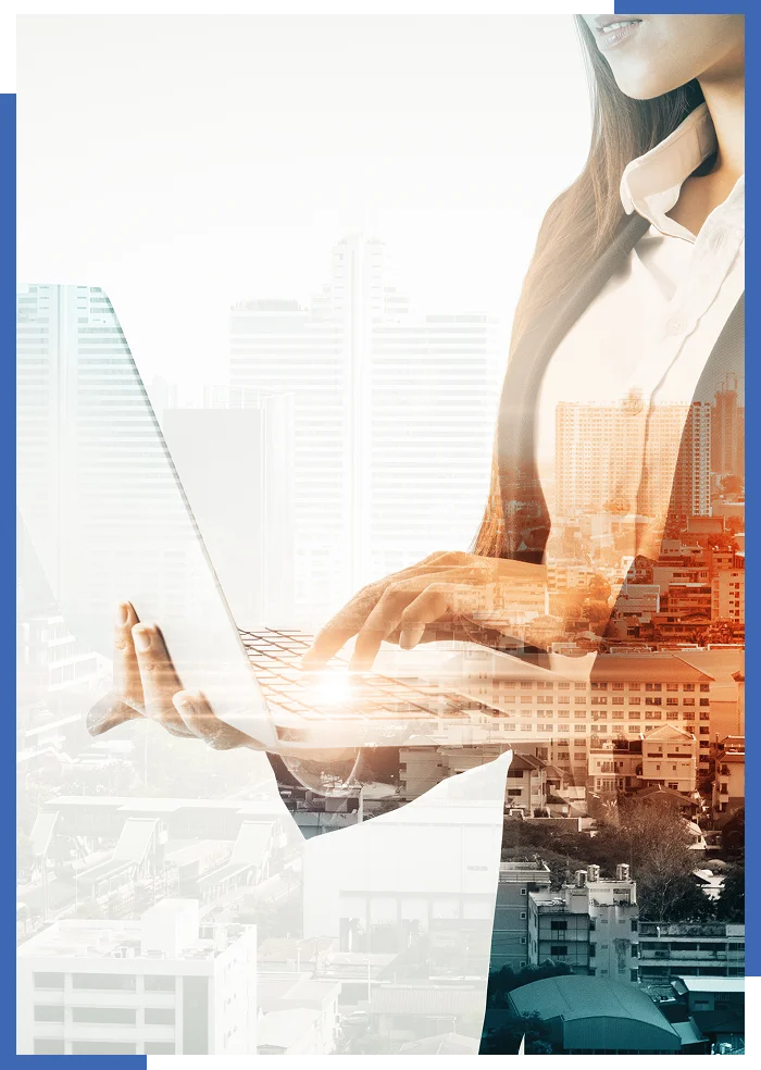 Businesswoman using laptop over cityscape background