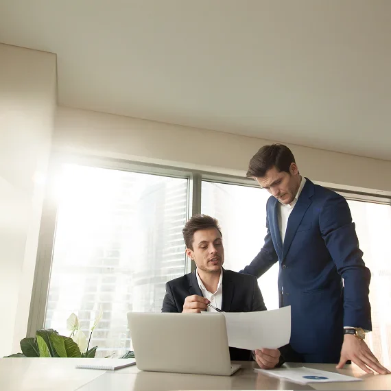 Two professionals reviewing documents
