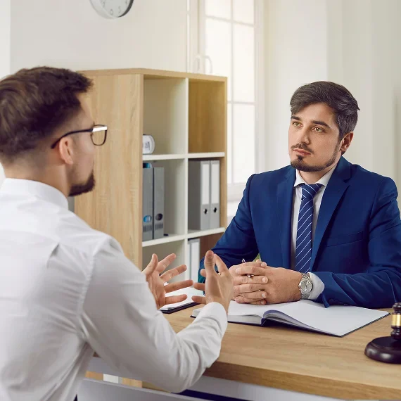 Colleagues engaged in a work conversation